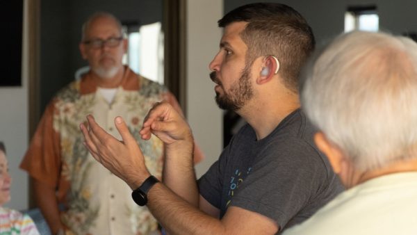 Zeth Pankhurst signs to a group at the National Deaf Christian Workshop.