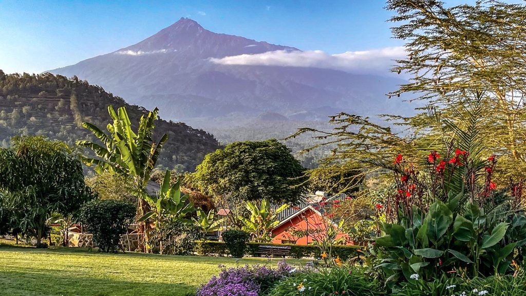 From the front porch of the Neema Village guest house, visitors can see Mount Meru (pictured) and, on clear mornings, Mount Kilimanjaro about 43 miles east.