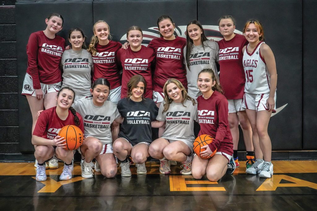 Oklahoma Christian Academy’s women’s varsity squad takes a team photo.