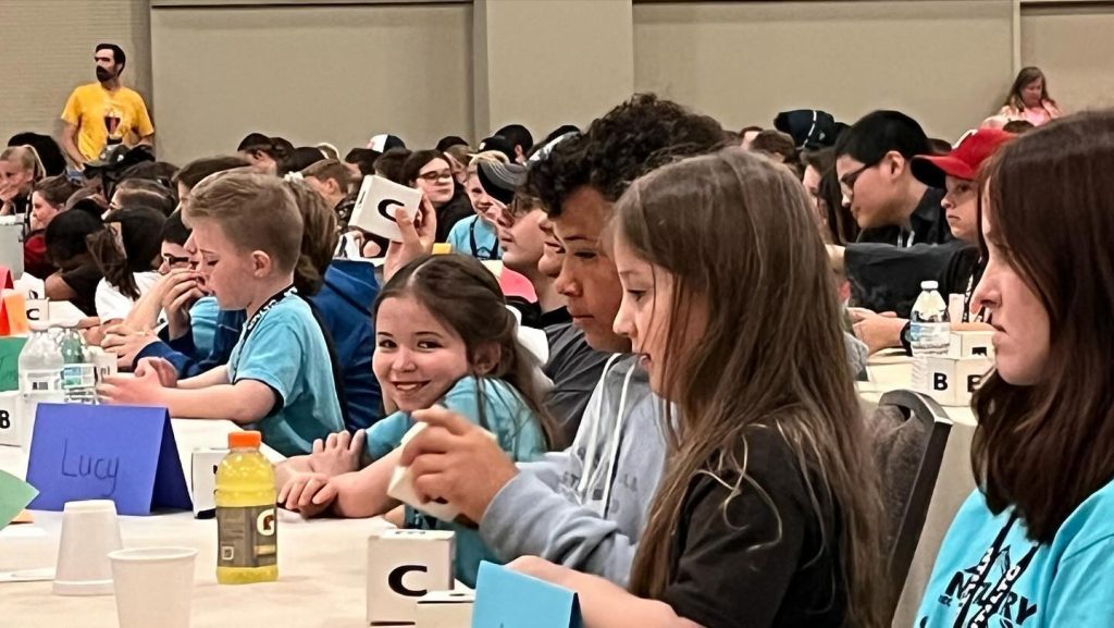 Bible Bowlers prepare for the three-hour session in a ballroom of the Hilton Anatole during the 2024 North Texas Leadership Training for Christ convention.