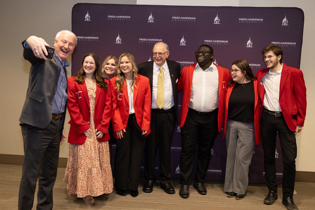 Freed-Hardeman University president David Shannon, left, takes a selfie with Sarah Pollock, Catherine Grisham, Caroline Grisham, Lads to Leaders executive director Roy Johnson, Heritage Christian University student Zaquan Kemp and Freed-Hardeman University students MacKenzie Scarborough and Jack Hamilton.