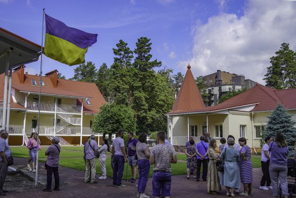 Participants in a three-day conference and retreat in Irpin, Ukraine, visit as they wait for the retreat center's breakfast room to open.