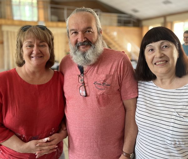 Igor Olefira and his wife, Vera, right, visit with Inna Kuzmenko, a Ukrainian translator who worshiped with the Olefira's congregation in Kharkiv before she moved to the western Ukrainian city of Ivano-Frankivsk. 